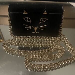 Charlotte Olympia Black and Gold Leather Clutch